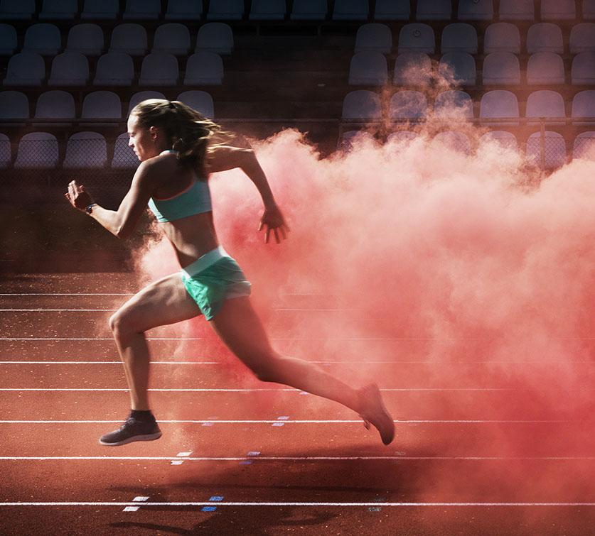 Runner leaving a cloud of smoke behind her